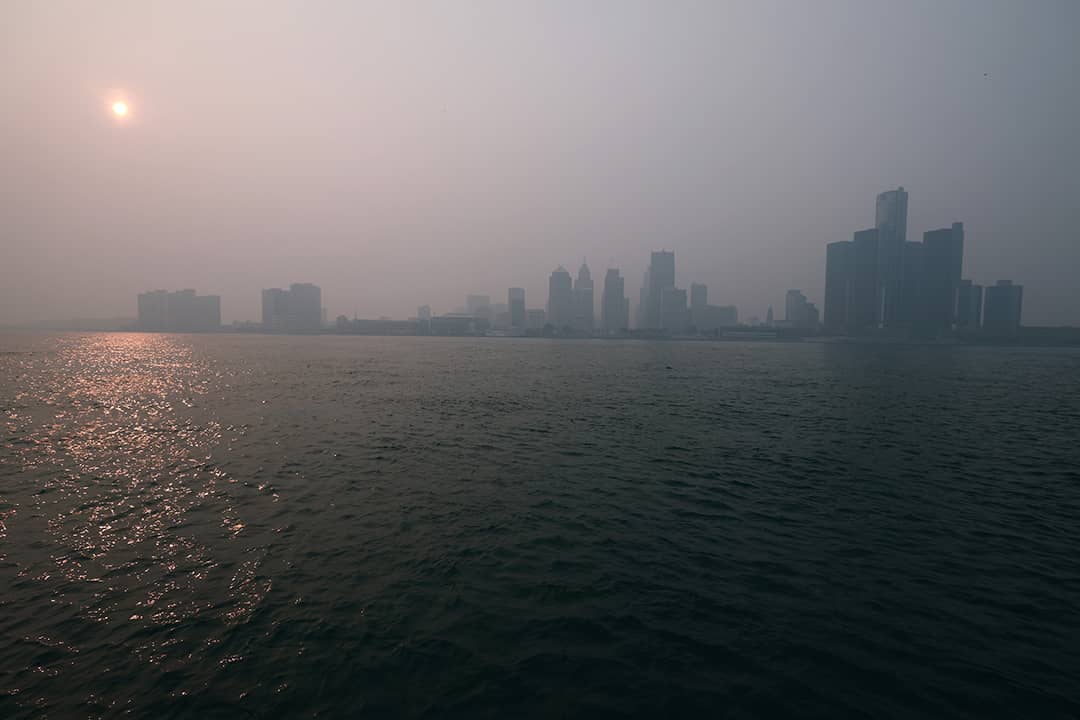View of the Detroit skyline from the shore of Windsor Canada as smoke from the Canadian wildfires settles in the city on July 16, 2026 in Detroit, Michigan.
